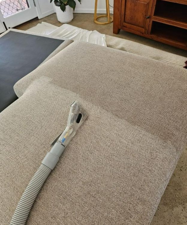 A Vacuum Cleaner on A Couch — Upholstery & Carpet Cleaning on the Sunshine Coast, QLD
