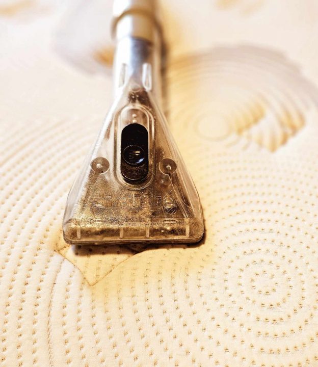Vacuum Cleaner on A Mattress — Upholstery & Carpet Cleaning on the Sunshine Coast, QLD